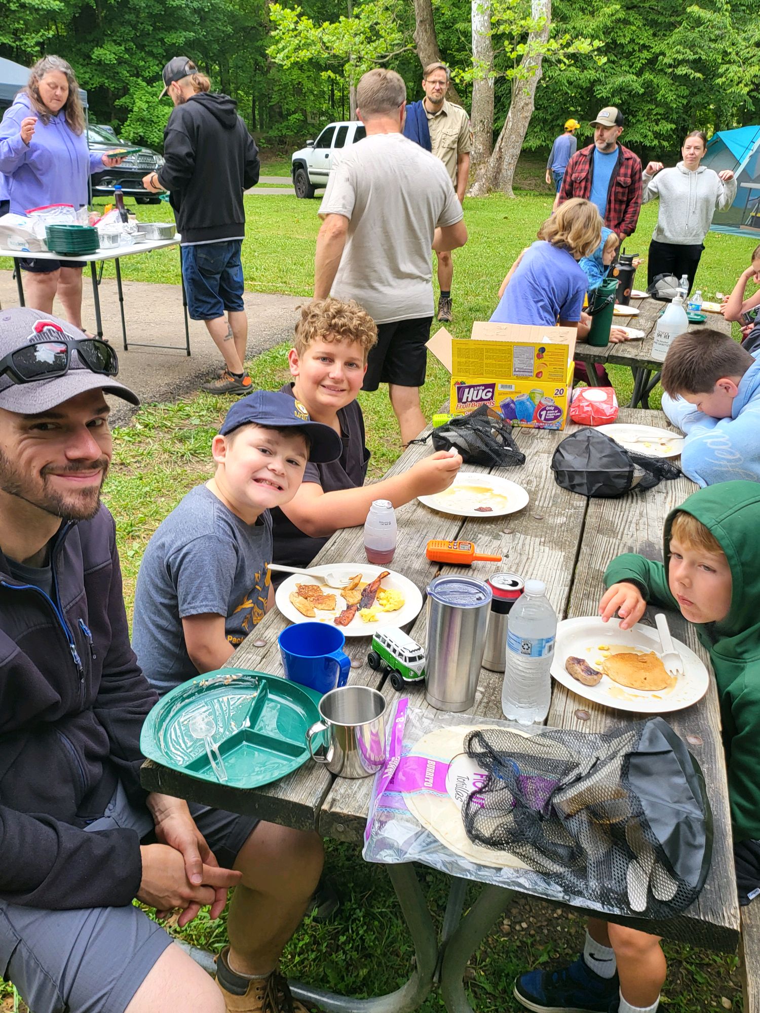 Pack 131 families enjoying breakfast together at camp