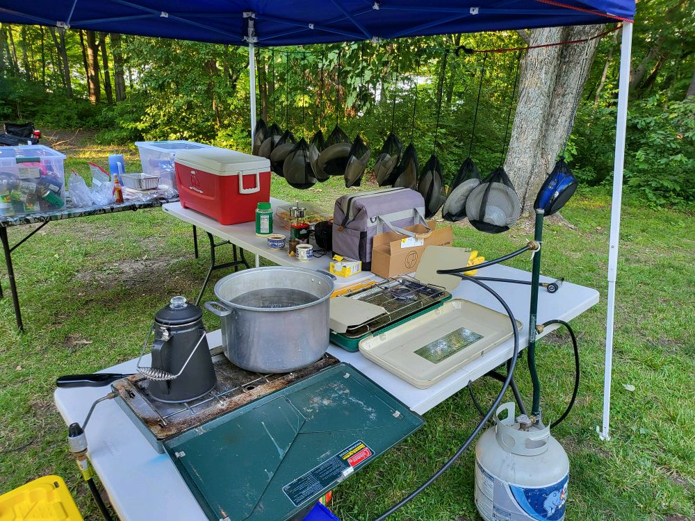 Adult leader cooking breakfast at the campsite