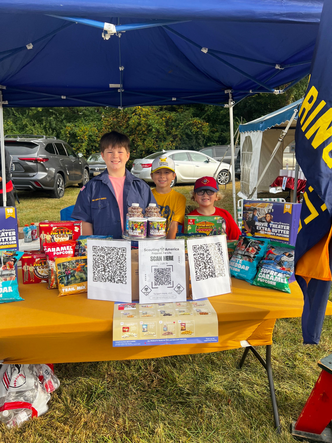 Scouts running an outdoor popcorn sale